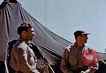 Image of Pilot examines flak damage to his P-47 aircraft Corsica France, 1944, second 47 stock footage video 65675051897