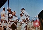Image of Pilot examines flak damage to his P-47 aircraft Corsica France, 1944, second 48 stock footage video 65675051897