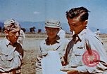 Image of Pilot examines flak damage to his P-47 aircraft Corsica France, 1944, second 50 stock footage video 65675051897