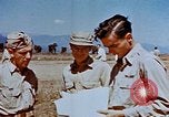 Image of Pilot examines flak damage to his P-47 aircraft Corsica France, 1944, second 51 stock footage video 65675051897