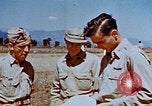 Image of Pilot examines flak damage to his P-47 aircraft Corsica France, 1944, second 52 stock footage video 65675051897