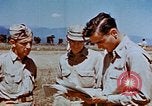 Image of Pilot examines flak damage to his P-47 aircraft Corsica France, 1944, second 53 stock footage video 65675051897
