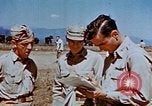Image of Pilot examines flak damage to his P-47 aircraft Corsica France, 1944, second 54 stock footage video 65675051897