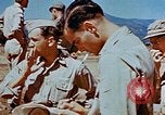 Image of Pilot examines flak damage to his P-47 aircraft Corsica France, 1944, second 58 stock footage video 65675051897