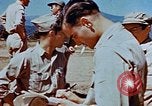 Image of Pilot examines flak damage to his P-47 aircraft Corsica France, 1944, second 61 stock footage video 65675051897