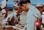 Image of Pilot examines flak damage to his P-47 aircraft Corsica France, 1944, second 62 stock footage video 65675051897