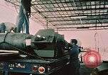 Image of loading bombs on B-52 aircraft in Vietnam War Guam, 1967, second 20 stock footage video 65675051905