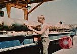 Image of loading bombs on B-52 aircraft in Vietnam War Guam, 1967, second 44 stock footage video 65675051905