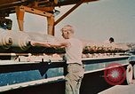 Image of loading bombs on B-52 aircraft in Vietnam War Guam, 1967, second 45 stock footage video 65675051905