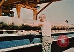 Image of loading bombs on B-52 aircraft in Vietnam War Guam, 1967, second 47 stock footage video 65675051905