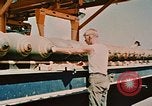 Image of loading bombs on B-52 aircraft in Vietnam War Guam, 1967, second 48 stock footage video 65675051905