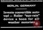 Image of man driving car Berlin Germany, 1930, second 8 stock footage video 65675052012