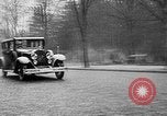 Image of man driving car Berlin Germany, 1930, second 12 stock footage video 65675052012