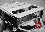 Image of man driving car Berlin Germany, 1930, second 18 stock footage video 65675052012