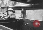 Image of man driving car Berlin Germany, 1930, second 29 stock footage video 65675052012