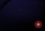 Image of descending parachute flares Vietnam Bien Hoa Air Base, 1967, second 11 stock footage video 65675052031