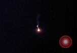 Image of descending parachute flares Vietnam Bien Hoa Air Base, 1967, second 16 stock footage video 65675052031