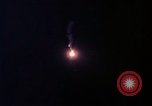 Image of descending parachute flares Vietnam Bien Hoa Air Base, 1967, second 17 stock footage video 65675052031