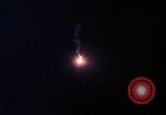 Image of descending parachute flares Vietnam Bien Hoa Air Base, 1967, second 18 stock footage video 65675052031