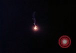 Image of descending parachute flares Vietnam Bien Hoa Air Base, 1967, second 19 stock footage video 65675052031