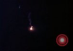Image of descending parachute flares Vietnam Bien Hoa Air Base, 1967, second 20 stock footage video 65675052031