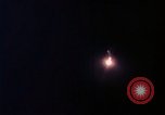 Image of descending parachute flares Vietnam Bien Hoa Air Base, 1967, second 22 stock footage video 65675052031