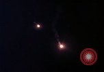 Image of descending parachute flares Vietnam Bien Hoa Air Base, 1967, second 29 stock footage video 65675052031