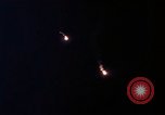 Image of descending parachute flares Vietnam Bien Hoa Air Base, 1967, second 30 stock footage video 65675052031