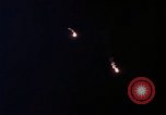 Image of descending parachute flares Vietnam Bien Hoa Air Base, 1967, second 31 stock footage video 65675052031