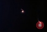 Image of descending parachute flares Vietnam Bien Hoa Air Base, 1967, second 36 stock footage video 65675052031