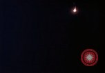 Image of descending parachute flares Vietnam Bien Hoa Air Base, 1967, second 58 stock footage video 65675052031