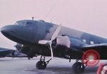 Image of camouflaged AC 47 aircraft Vietnam Bien Hoa Air Base, 1967, second 9 stock footage video 65675052032
