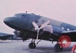 Image of camouflaged AC 47 aircraft Vietnam Bien Hoa Air Base, 1967, second 10 stock footage video 65675052032