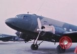 Image of camouflaged AC 47 aircraft Vietnam Bien Hoa Air Base, 1967, second 11 stock footage video 65675052032