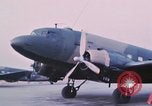 Image of camouflaged AC 47 aircraft Vietnam Bien Hoa Air Base, 1967, second 12 stock footage video 65675052032