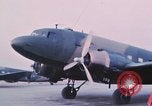 Image of camouflaged AC 47 aircraft Vietnam Bien Hoa Air Base, 1967, second 13 stock footage video 65675052032