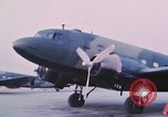Image of camouflaged AC 47 aircraft Vietnam Bien Hoa Air Base, 1967, second 15 stock footage video 65675052032