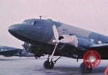 Image of camouflaged AC 47 aircraft Vietnam Bien Hoa Air Base, 1967, second 16 stock footage video 65675052032