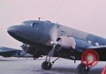 Image of camouflaged AC 47 aircraft Vietnam Bien Hoa Air Base, 1967, second 20 stock footage video 65675052032