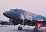 Image of camouflaged AC 47 aircraft Vietnam Bien Hoa Air Base, 1967, second 21 stock footage video 65675052032