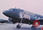 Image of camouflaged AC 47 aircraft Vietnam Bien Hoa Air Base, 1967, second 22 stock footage video 65675052032