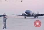 Image of camouflaged AC 47 aircraft Vietnam Bien Hoa Air Base, 1967, second 25 stock footage video 65675052032