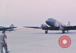 Image of camouflaged AC 47 aircraft Vietnam Bien Hoa Air Base, 1967, second 26 stock footage video 65675052032