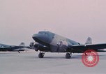 Image of camouflaged AC 47 aircraft Vietnam Bien Hoa Air Base, 1967, second 34 stock footage video 65675052032