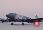 Image of camouflaged AC 47 aircraft Vietnam Bien Hoa Air Base, 1967, second 36 stock footage video 65675052032