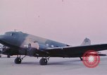 Image of camouflaged AC 47 aircraft Vietnam Bien Hoa Air Base, 1967, second 37 stock footage video 65675052032