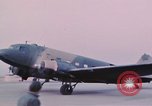Image of camouflaged AC 47 aircraft Vietnam Bien Hoa Air Base, 1967, second 38 stock footage video 65675052032