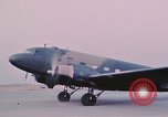 Image of camouflaged AC 47 aircraft Vietnam Bien Hoa Air Base, 1967, second 39 stock footage video 65675052032