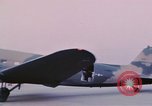 Image of camouflaged AC 47 aircraft Vietnam Bien Hoa Air Base, 1967, second 41 stock footage video 65675052032