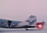 Image of camouflaged AC 47 aircraft Vietnam Bien Hoa Air Base, 1967, second 42 stock footage video 65675052032